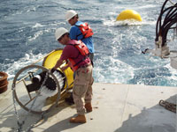 Don Hickey and Eric Tappa deploy a sediment trap