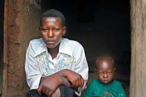 Photo:AIDS Orphan Mukamana Pascasie, with her three-year-old sister Solange.