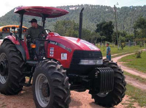Photo: Jose Gomez on a USAID finded tractor