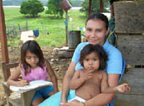 Cecilia Arboleda Jaramillo relaxes with her daughters at her family’s San Jose dairy farm.