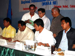 Regional Secretary Kabuntalan Emblawa, second from left, and other officials sign the Implementing Rules and Regulations for the Forest Management Act.