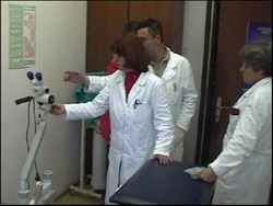 Uzice doctors view new colposcope donated by USAID.