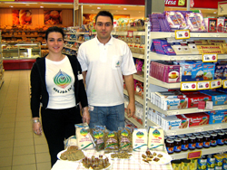 Heljda Eko staff Bilsana Bajramovic and Denis Hrnicevic celebrate World Healthy Food Day with a display of their company’s foods at the Mercator Supermarket in Sarajevo.