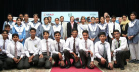 USAID Mission Director Anne Aarnes with a group of Pakistani secondary school students who returned from the United States after participating in a two-week student exchange program. Click for larger photo.