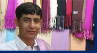 Pakistani man selling shawls