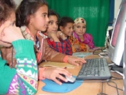 Photo of Egyptian girls learning at a computer.  Photo: USAID/Egypt