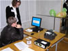 Golos-trained observers watch an electronic voting computer tally votes at a polling station in Novgorod