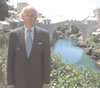Administrator Natsios stands in front of Mostar’s newly reconstructed 'Old Bridge'