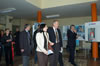 Ambassador MacElhaney joins crowd at the USAID 10th Anniversary Photo Exhibit at the Youth Conference Exhibit Hall