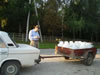 In rural Moldova, milk is collected daily from hundreds of local households with one or two cows. Selling extra milk is one of the few ways villagers can augment their $200-400 annual income. Here, American Farmer-to-Farmer volunteer John Kappelman records part of a day's yield.