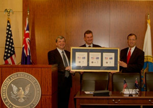 ASIC Chairman Tony D'Aloisio, Senator Nick Sherry, and SEC Chairman Christopher Cox exhibit their mutual recognition agreement at a Washington D.C. news conference.