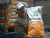 USAID Agribusiness Specialist, Paul Trupo, unloads Pioneer seed in Timiosara