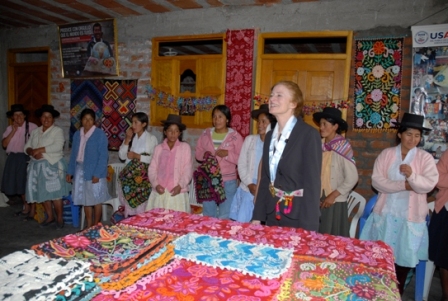 Administrator Fore speaks with a beneficiary of USAID's poverty reducation project (PRA) in Ayacucho.  The project connects producers with consumers and markets worldwide