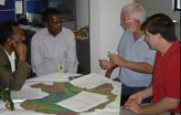 A USAID geographic information systems specialist meets with USAID staff in Ethiopia.