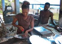 uccessful beneficiary from the Micro-Enterprise Loan Program applies her trade for income.