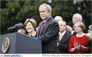 With Mrs. Laura Bush, the Vice President and Mrs. Cheney and Cabinet secretaries looking on, President George W. Bush addresses his staff Thursday, Nov. 6, 2008, on the South Lawn of the White House. Said the President, "As we head into this final stretch, I ask you to remain focused on the goals ahead. I will be honored to stand with you at the finish line."  White House photo by Eric Draper