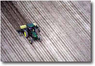 aerial photo of a tractor in a field