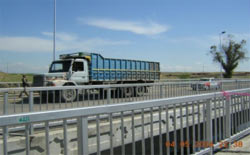 Photo: Vehicles crossing the newly-reopened bridge