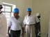 A supervisor and the owner of an Iraqi construction firm in the Al Nijoom School room.