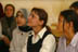 Iraqi school girls listen to their teacher in the Agadir Secondary school in the Saydiya neighborhood of Baghdad. Several rooms of the school were looted during the war. USAID is looking at refurbishing the school.