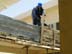 Alsabah Construction worker removing the frame for a concrete wall at the Al Nijoom school.