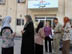 Iraqi women outside the entrance to the Fatima Al-Zahra Center for Women's Rights, (named by the community after Fatima Al-Zahra, who was the daughter of the Prophet Mohammed) in Hilla, (1 hour south of Baghdad). The women's center is the first of five to open in the South Central Region of Iraq. The CPA and USAID/OTI worked with women from across Babil Provence to establish the center. The center is open to all and offers nutrition and health classes, internet/computer training, and sewing facilities The center well generate income through sewing production, a planned food catering business and internet cafe.