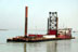 The Carolina, a dredging vessel of Great Lakes Dredging and Dock, arrives in the port of Umm Qasr. As part of its capital infrastructure contract with the U.S. Agency for International Development, Bechtel's initial work includes surveying and emergency dredging of the port, to enable ships to deliver humanitarian aid. May 7, 2003. (Photo by Thayer Walker for Bechtel)