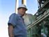 An engineer supervises work being carried out at the Al-Doura power plant in Baghdad, Iraq. USAID is funding the repair of Iraq's nationwide electrical system.