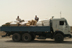 Food aid leaves a World Food Program warehouse in Umm Qasr, southern Iraq. USAID supports the program which provides basic food rations to a large number of needy families in Southern Iraq.