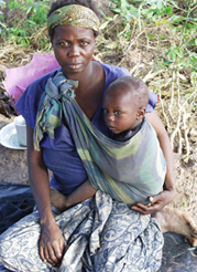 photo of Angolan mother carrying child. USAID/Lloyd Feinberg