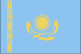 Flag of Kazakhstan is sky blue background with a gold sun with 32 rays above a golden steppe eagle in the center; on the hoist side is a 'national ornamentation' in gold.