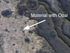 Martian rocks containing a hydrated mineral similar to opal
