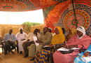 Photo: Participants receive training on negotiation and peace building at a Khartoum-area IDP camp.