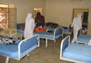 Nurses attend to patients in the newly refurbished in-patient ward at Kadugli Hospital.