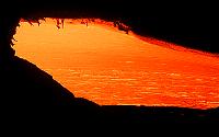 Close-up of lava coming from tube at head of flow across Middle Highcastle delta, Kilauea volcano, Hawai'i