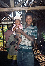 Photo of a young man holding his child.