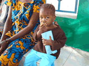 2 year old Hawa Ndiaye eating nutrient rich porridges