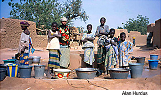 Children in Mali gather water from a community well. Photo Source: Alan Hurdus