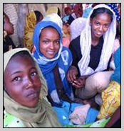 Photo of group of African women, looking at the camera.