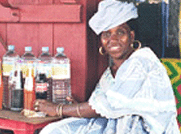 Photo of a woman selling beverages.