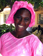 Photo of a woman at a bednet retreatment launch in Thies, Senegal. 