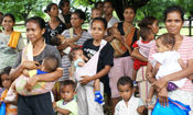 Timorese mothers and their children receiving insecticid-treated bednets Photo: TAIS