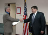 USAID/Serbia & Montenegro Mission Director Keith Simmons (left) welcomes Joseph Taggart following his swearing-in ceremony