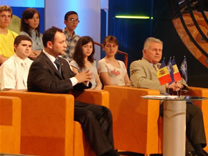 Vice Minister Dodon (in dark suit at left) explains the new law to citizens on a live broadcast of 'Buna Seara (Good Evening),' a Moldovan talk show