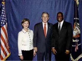 Mission Director Rudolph Thomas with President George W Bush, and First Lady Laura Bush during their visit to Benin on February 16 2008