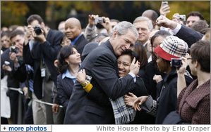 President George W. Bush embraces an employee of the Executive Office of the President Thursday, Nov. 6, 2008, after delivering remarks to his staff on the upcoming transition. Said the President, ".Over the next 75 days, all of us must ensure that the next President and his team can hit the ground running.'  White House photo by Eric Draper
