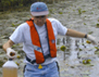 Photo showing Brian Hughes working in the Okefenokee swamp, GA