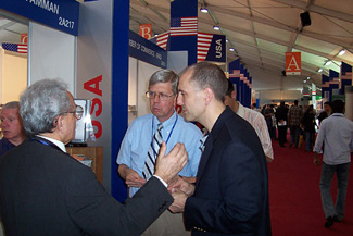  U.S. Commercial Officers from the U.S. Embassy in Baghdad counsel an Iraqi businessman attending the Rebuild Iraq 2006 trade event. (May 2006, Amman, Jordan).