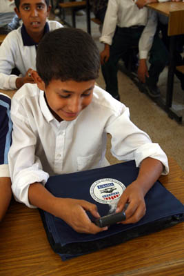 photo: A student from the Zein Al Abdeen secondary boy's school