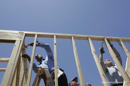 President George W. Bush hammers nails with New Orleans Mayor Ray Nagin on a home constructed by volunteers in the Upper 9th Ward of New Orleans, Louisiana, Thursday, April 27, 2006.